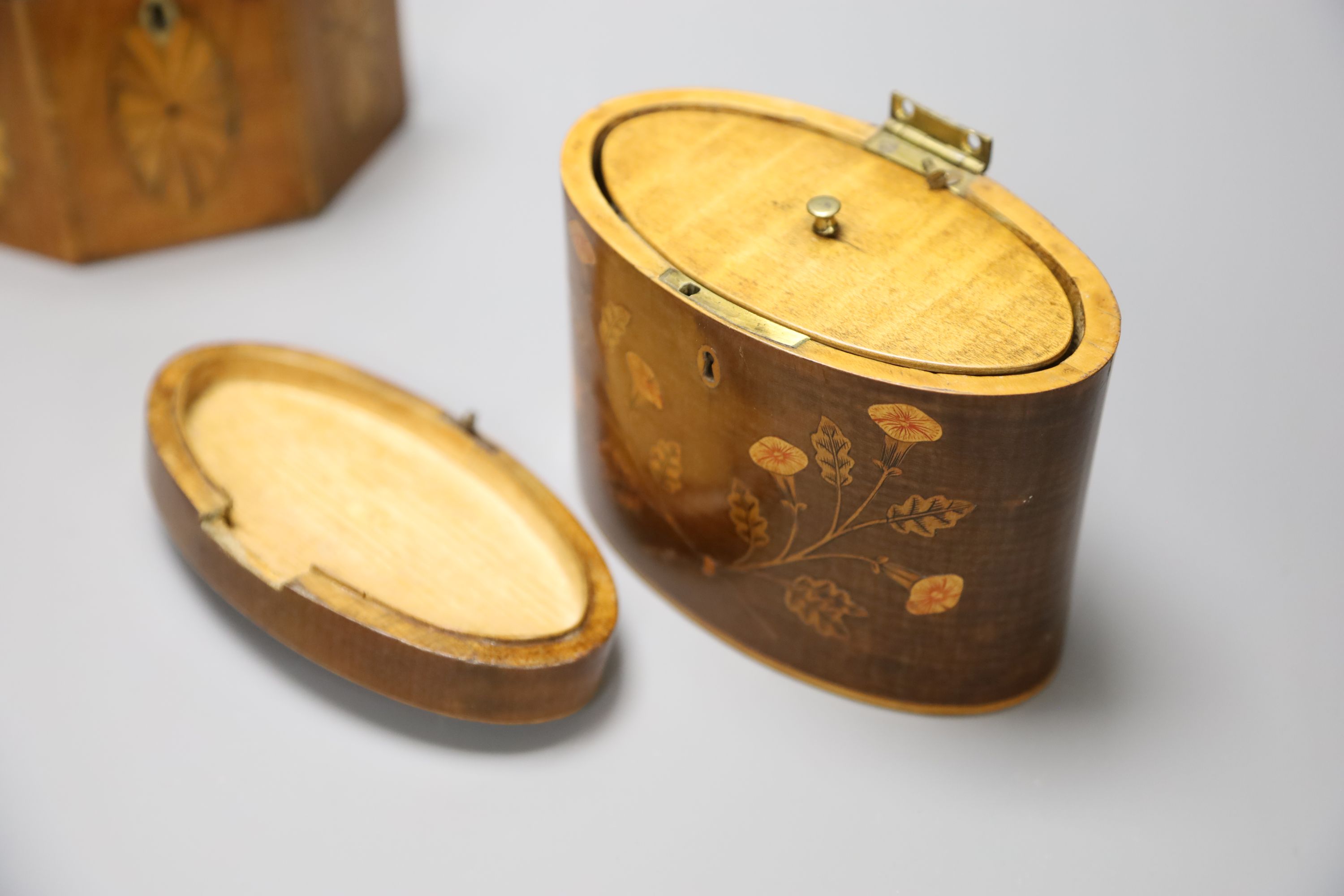 A George III oval marquetry tea caddy and a hexagonal caddy. tallest 11.5cm